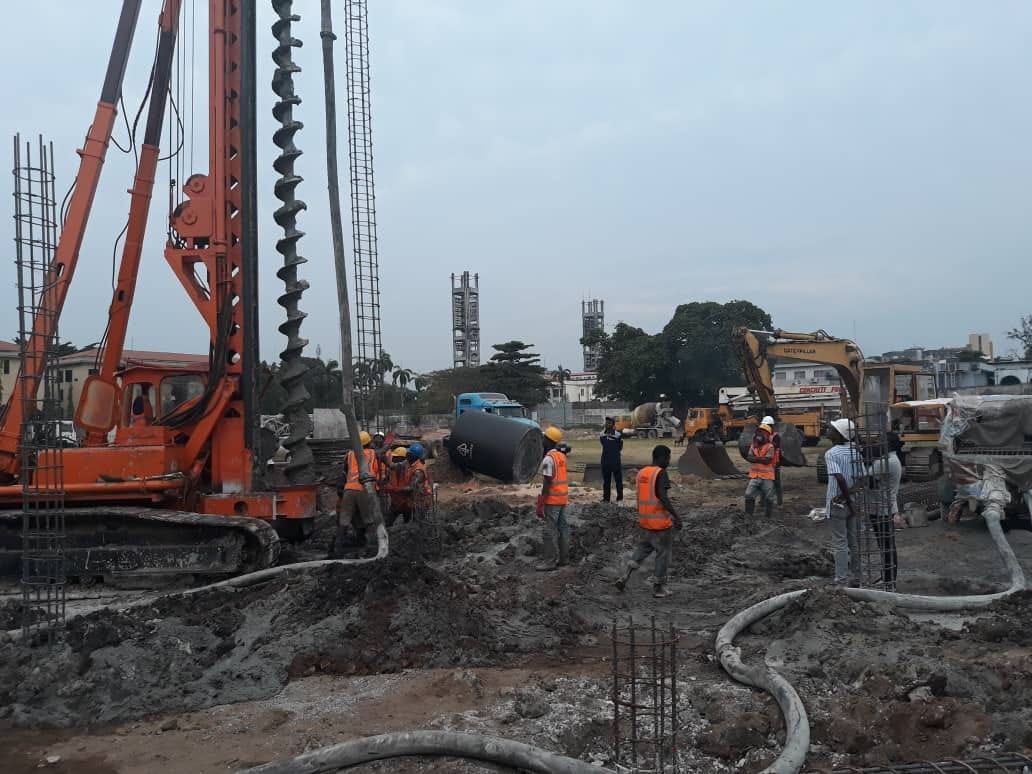 Multi-rig GTGABOD foundation site with crew and concrete mixer trucks